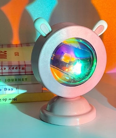 Proyector arcoíris con orejas de conejo
