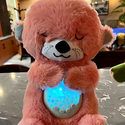 Peluche nutria que duerme con luz