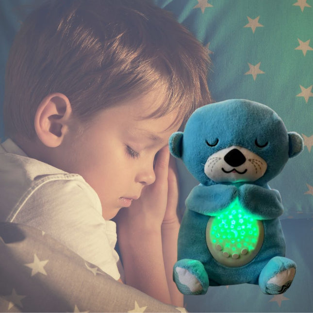 Peluche nutria que duerme con luz