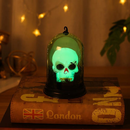Lámpara calavera en cúpula de cristal
