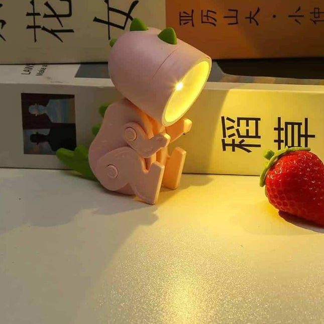 Mini lámpara LED dinosaurio pinza lectura