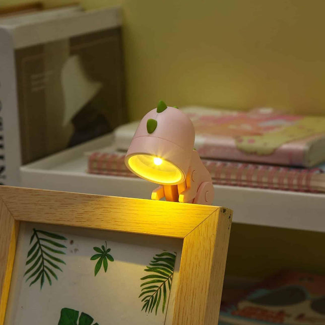 Mini lámpara LED dinosaurio pinza lectura
