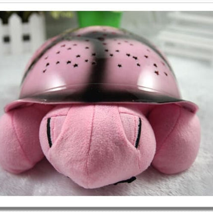 Peluche tortuga proyector de estrellas musical