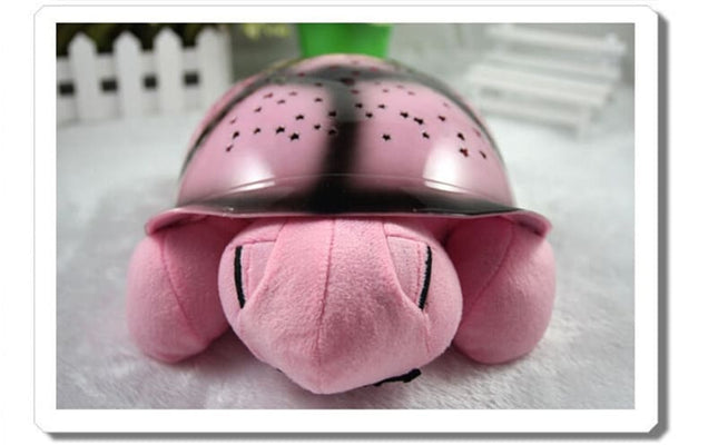 Peluche tortuga proyector de estrellas musical